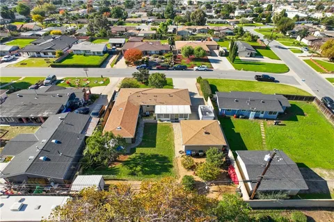 an aerial view of residential houses with outdoor space