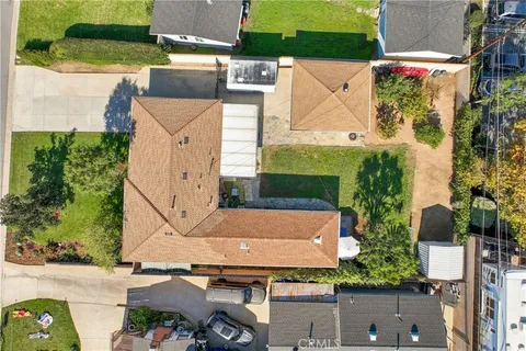 an aerial view of residential houses with outdoor space