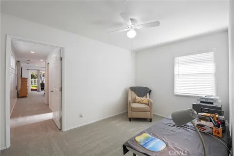 a living room with furniture and a chair
