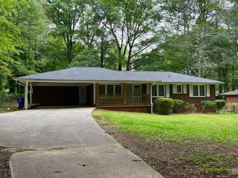 3509 New MacLand Road Powder Springs, GA 30127 - Photo 1 of 1 a front view of a house with a yard and garage