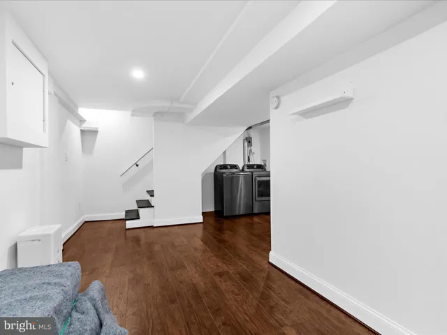 a view of a livingroom with wooden floor