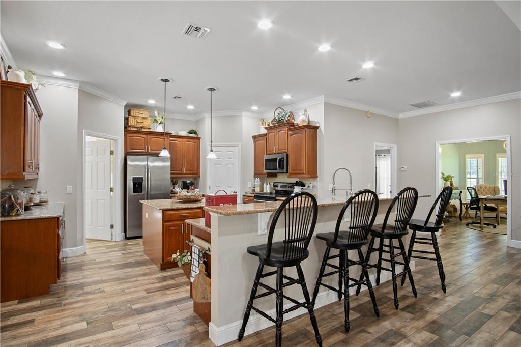 9045 Lake Hatchineha Road Kissimmee, FL 34759 - Photo 20 of 47 a view of a dining area with furniture