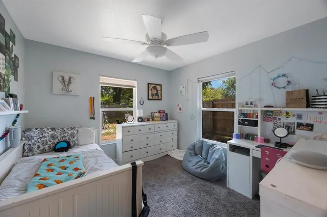 a room with a bed furniture and a window