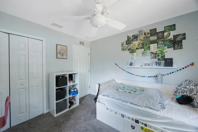 a bedroom with bed and a window