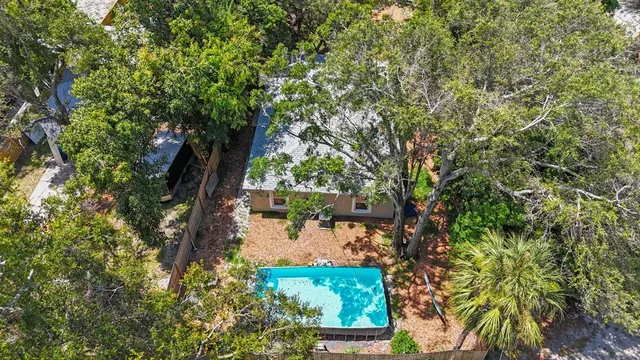 a view of a tree with a yard