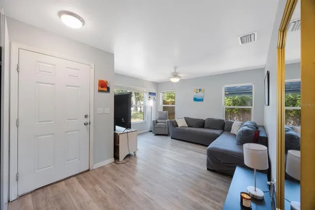a living room with furniture and a window