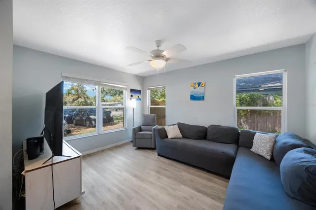 a living room with furniture and a flat screen tv