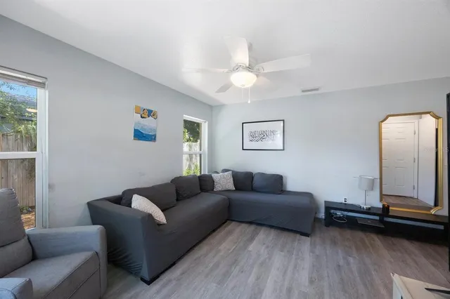 a living room with furniture and a window