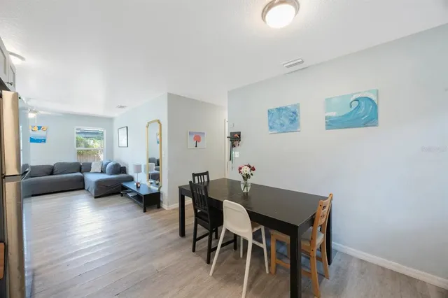 a view of a livingroom with furniture and wooden floor