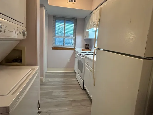 a view of a kitchen from the hallway