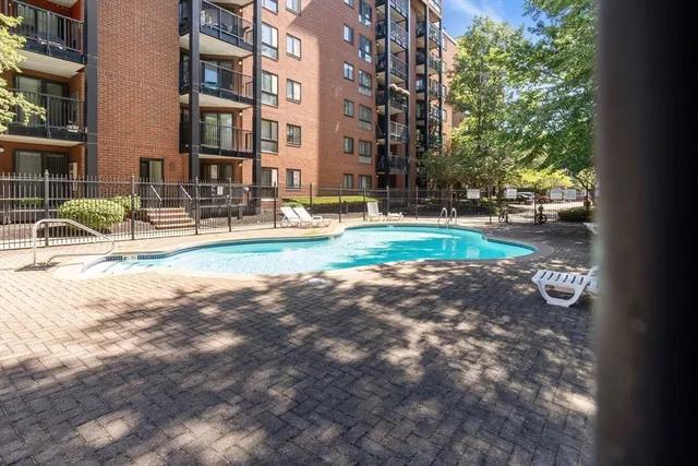 a view of pool with outdoor seating