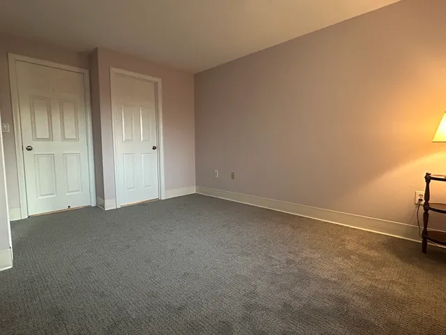 a view of an empty room and a window