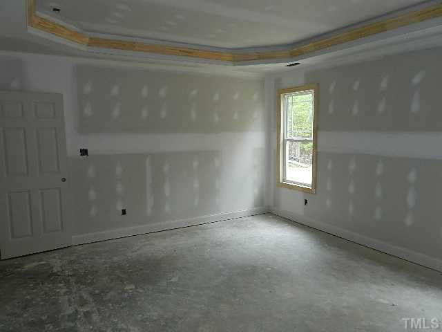 32 High Ridge Court Willow Spring, NC 27592 - Photo 13 of 23 en empty room with windows and closet