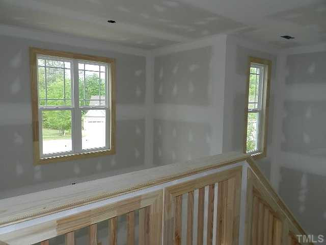 32 High Ridge Court Willow Spring, NC 27592 - Photo 15 of 23 a view of wooden floor and windows in a room
