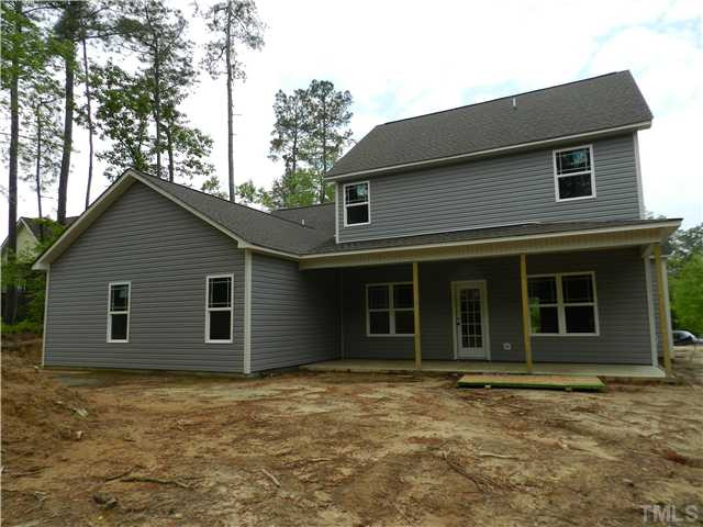 32 High Ridge Court Willow Spring, NC 27592 - Photo 22 of 23 a house with trees in the background