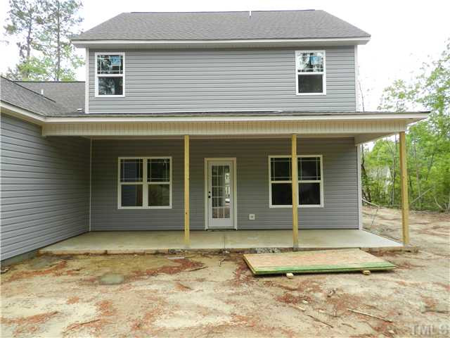 32 High Ridge Court Willow Spring, NC 27592 - Photo 23 of 23 a view of a house with a wooden door