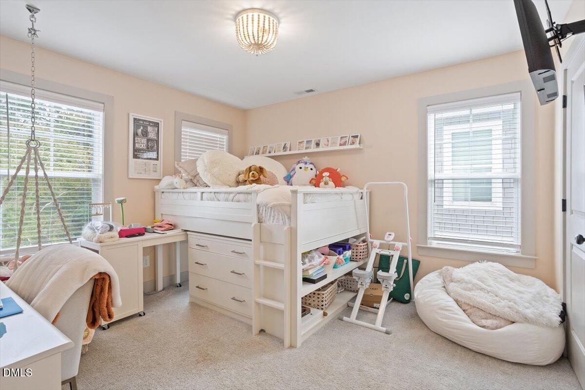 1303 Nottingham Road Raleigh, NC 27607 - Photo 18 of 33 a bedroom with furniture and a large window