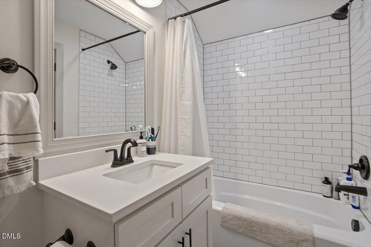 1303 Nottingham Road Raleigh, NC 27607 - Photo 28 of 33 a bathroom with a sink and a bathtub