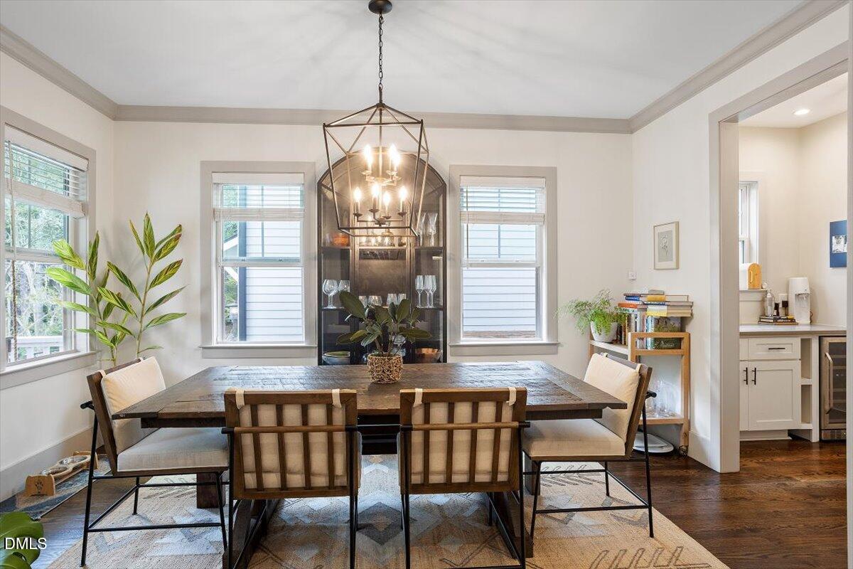 1303 Nottingham Road Raleigh, NC 27607 - Photo 3 of 33 a view of a dining room with furniture window and wooden floor