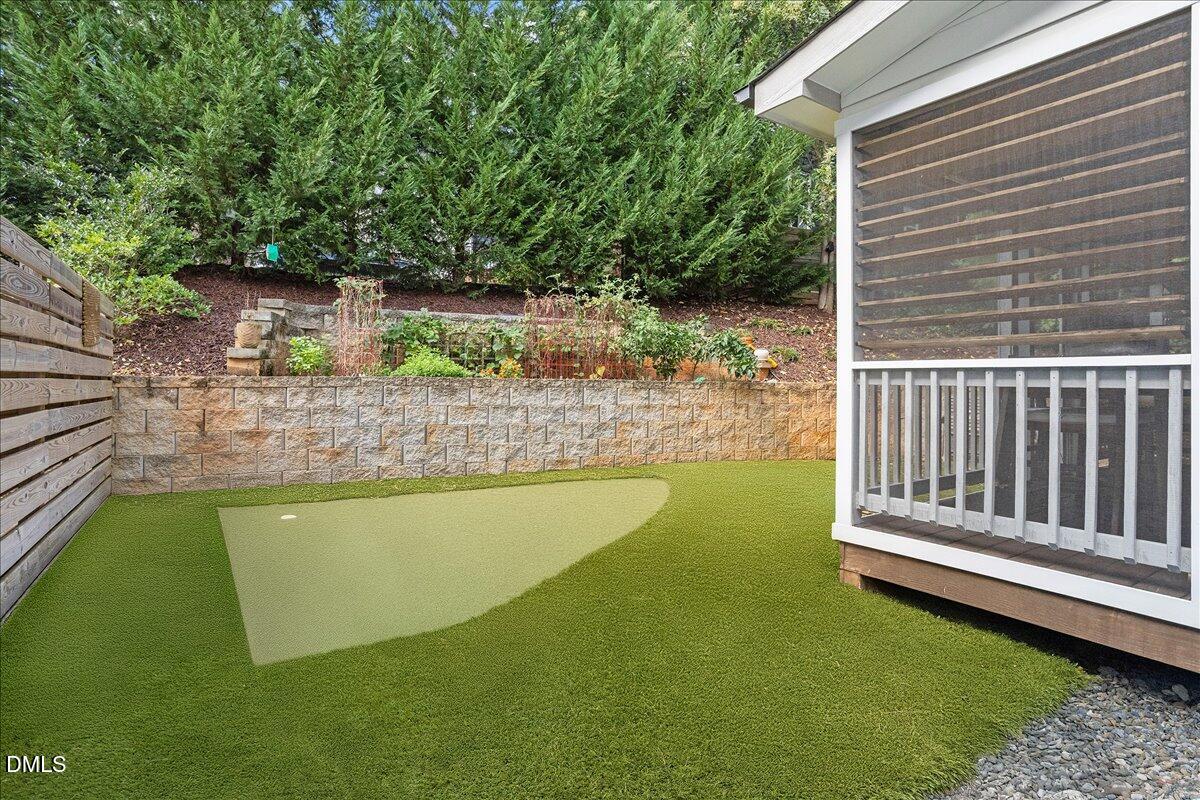 1303 Nottingham Road Raleigh, NC 27607 - Photo 33 of 33 a view of a swimming pool with a garden