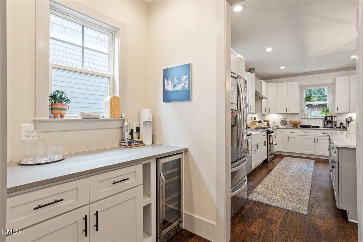 1303 Nottingham Road Raleigh, NC 27607 - Photo 6 of 33 a kitchen with cabinets and a window