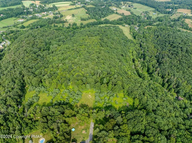 an aerial view of residential house with outdoor space