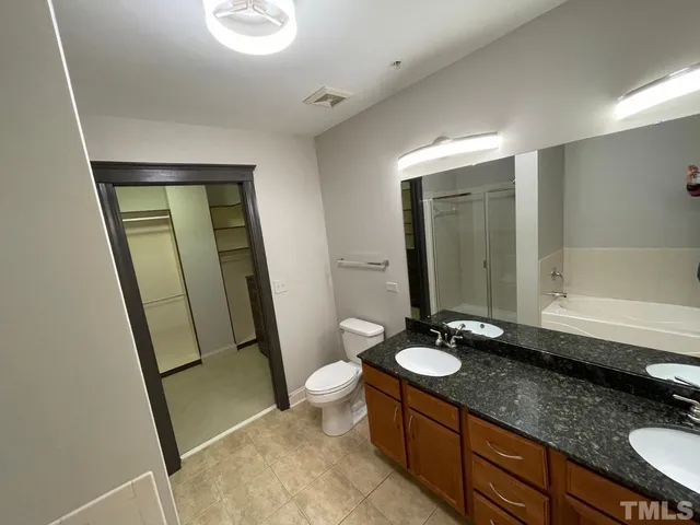 a bathroom with a sink a toilet and tub