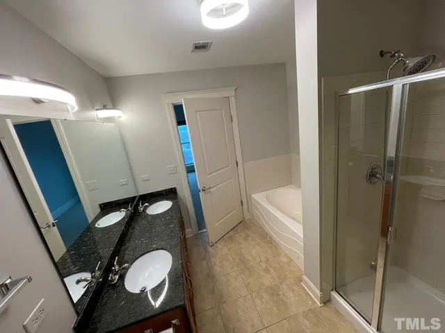 a bathroom with a sink a vanity and a mirror