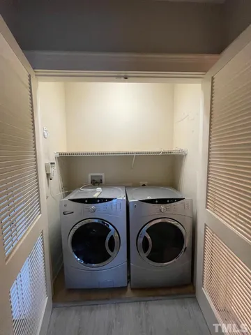 a view of a terrace with a table and chairs