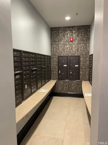 a large kitchen with stainless steel appliances kitchen island granite countertop a refrigerator and a stove top oven