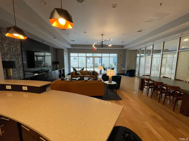 a black and white cabinet with wooden floor