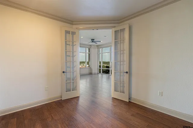 a dining room with a table and paintings