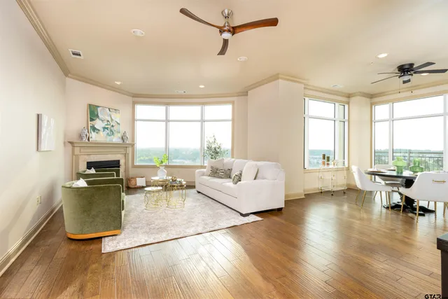 a dining room with furniture window and wooden floor