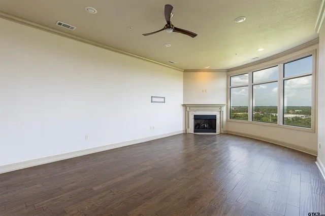 a living room with furniture large window and a table