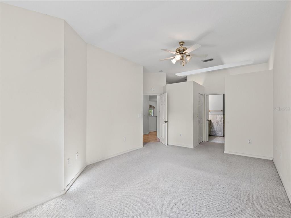 11621 Holly Ann Drive New Port Richey, FL 34654 - Photo 25 of 59 an empty room with a ceiling fan and a window