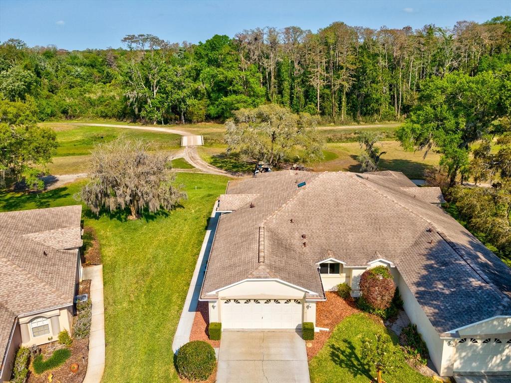 11621 Holly Ann Drive New Port Richey, FL 34654 - Photo 3 of 59 a view of a yard in front of the house