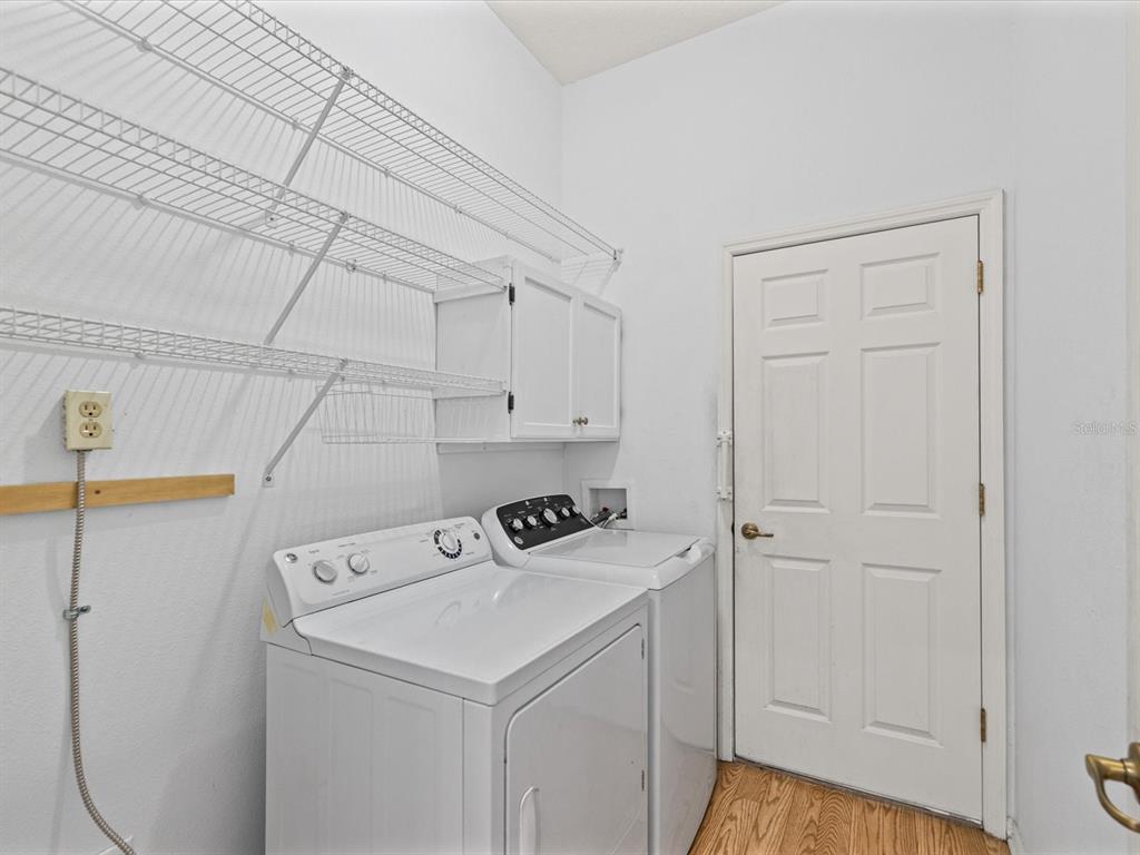 11621 Holly Ann Drive New Port Richey, FL 34654 - Photo 36 of 59 a utility room with dryer and washer