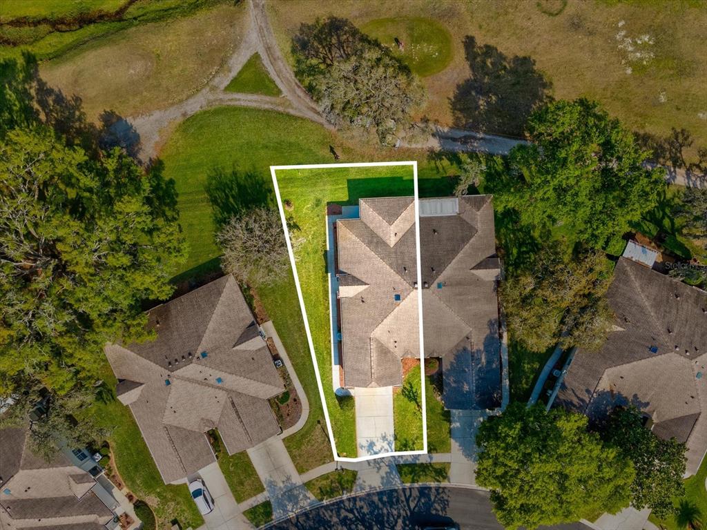 11621 Holly Ann Drive New Port Richey, FL 34654 - Photo 4 of 59 an aerial view of a house with a yard