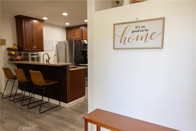 a view of kitchen with cabinets and wooden floor