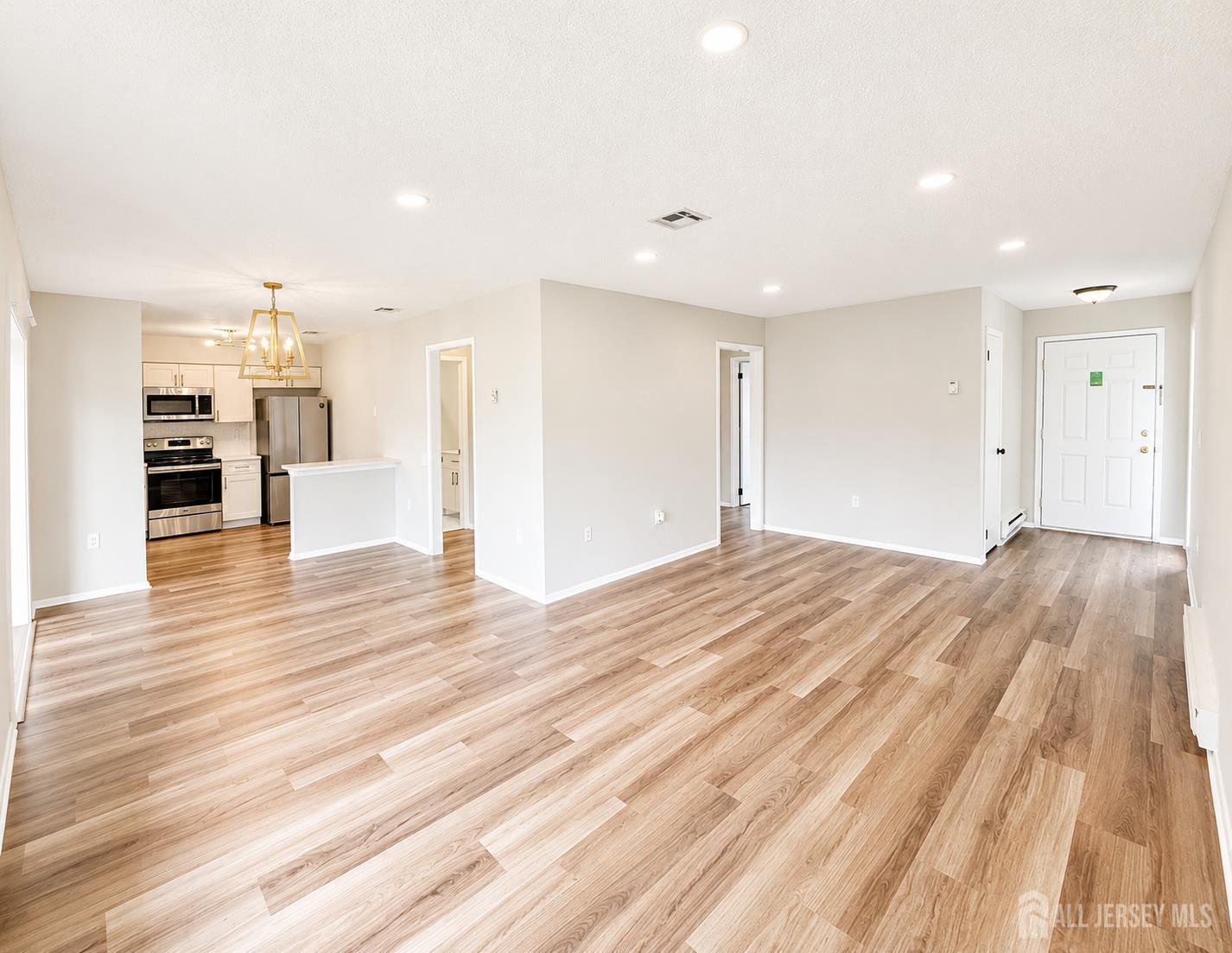 621 A Deal Road Monroe Township, NJ 08831 - Photo 5 of 27 a view of empty room with wooden floor