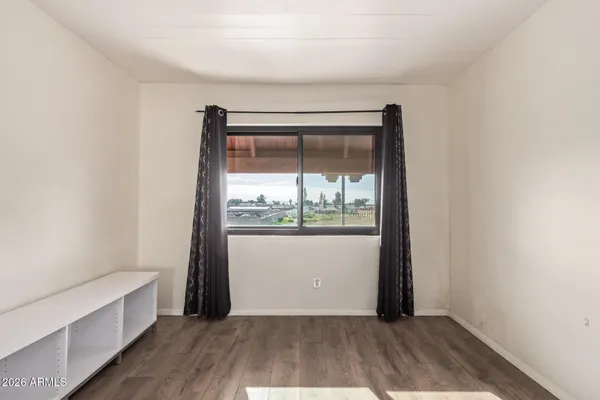 a view of an empty room with a window