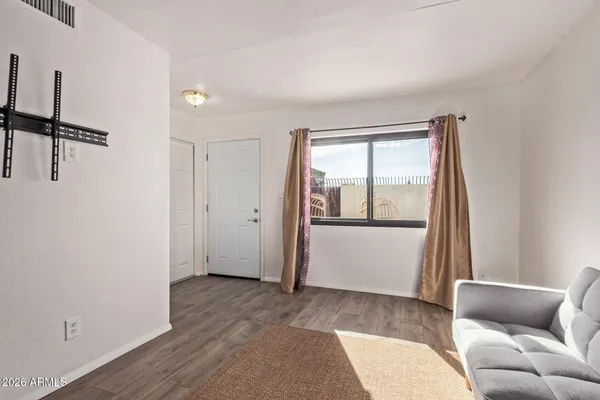 a living room with furniture and a window