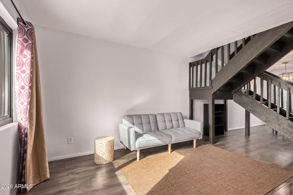 a living room with furniture and a window