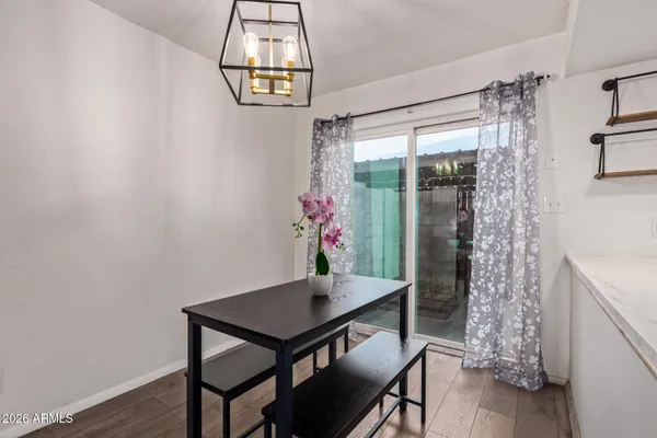 a view of a dining room with furniture window and wooden floor
