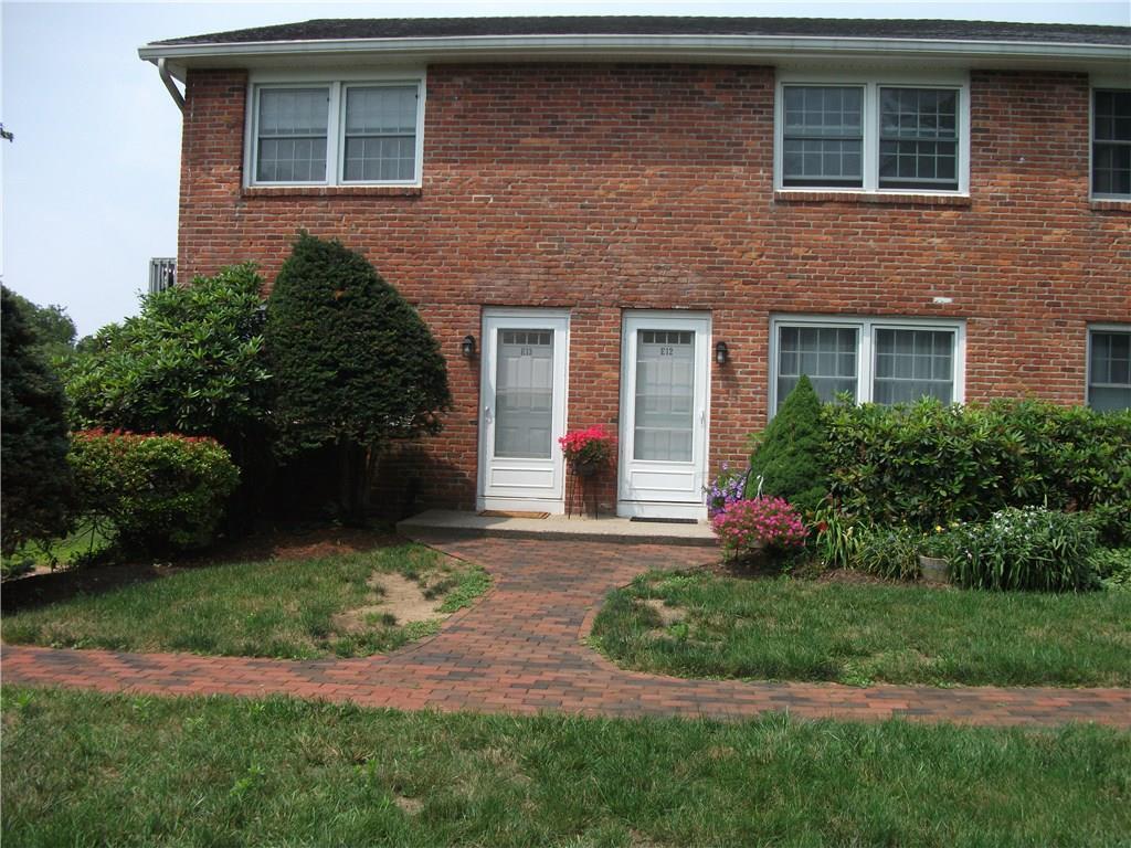 25 Riverside Drive, Unit E13 Clinton, CT 06413 - Photo 1 of 1 a front view of a house with yard and green space