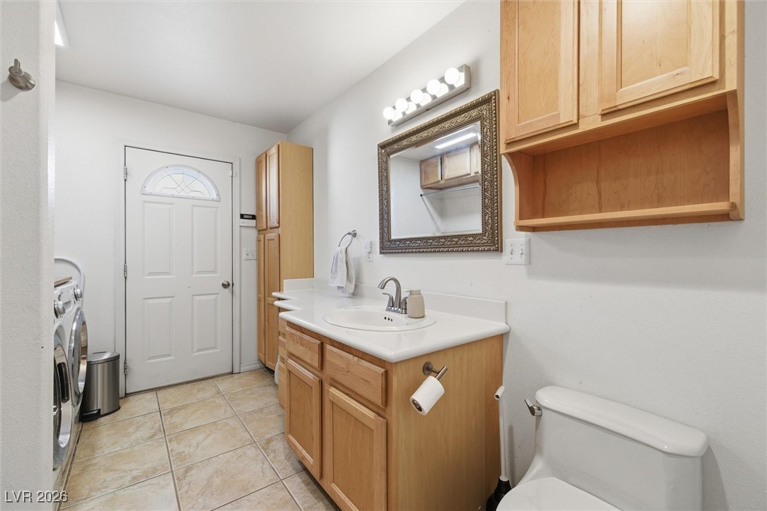 2570 East Kellogg Road Pahrump, NV 89048 - Photo 37 of 60 Laundry room, extra bathroom with shower and access to outside. Perfect to rise off after getting out of the pool.