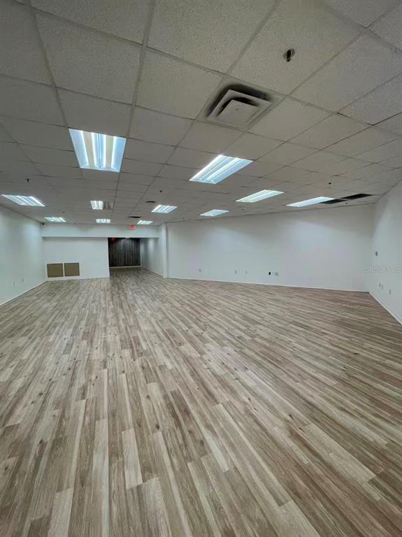 7075 Kingspointe Parkway, Unit 9 Orlando, FL 32819 - Photo 28 of 49 a view of a room with a wooden floor