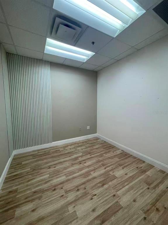 7075 Kingspointe Parkway, Unit 9 Orlando, FL 32819 - Photo 32 of 49 a view of empty room with wooden floor