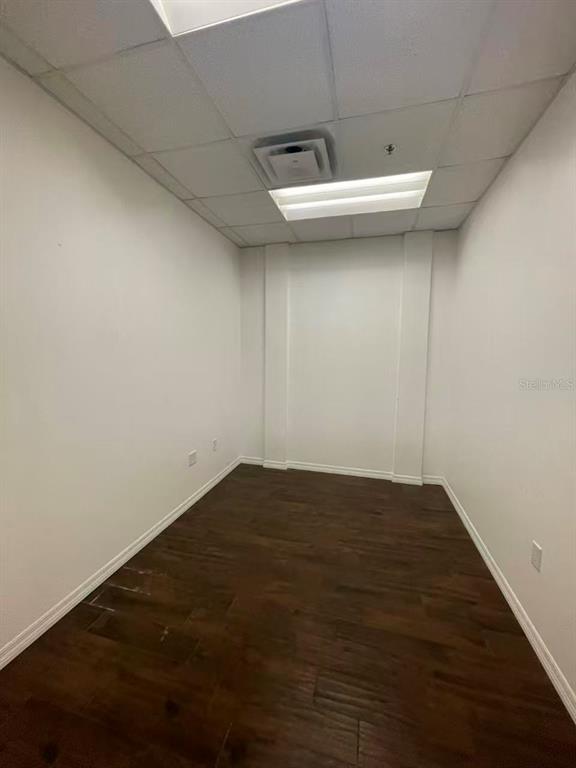 7075 Kingspointe Parkway, Unit 9 Orlando, FL 32819 - Photo 38 of 49 a view of a room with wooden floor and sink