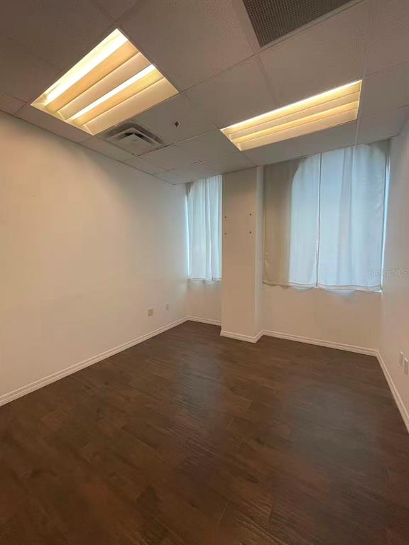 7075 Kingspointe Parkway, Unit 9 Orlando, FL 32819 - Photo 42 of 49 an empty room with windows